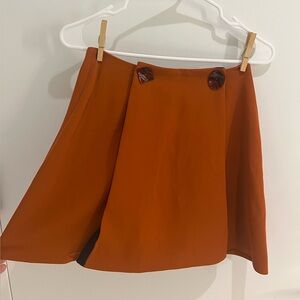 Stylish Orange Skirt with Button Detail